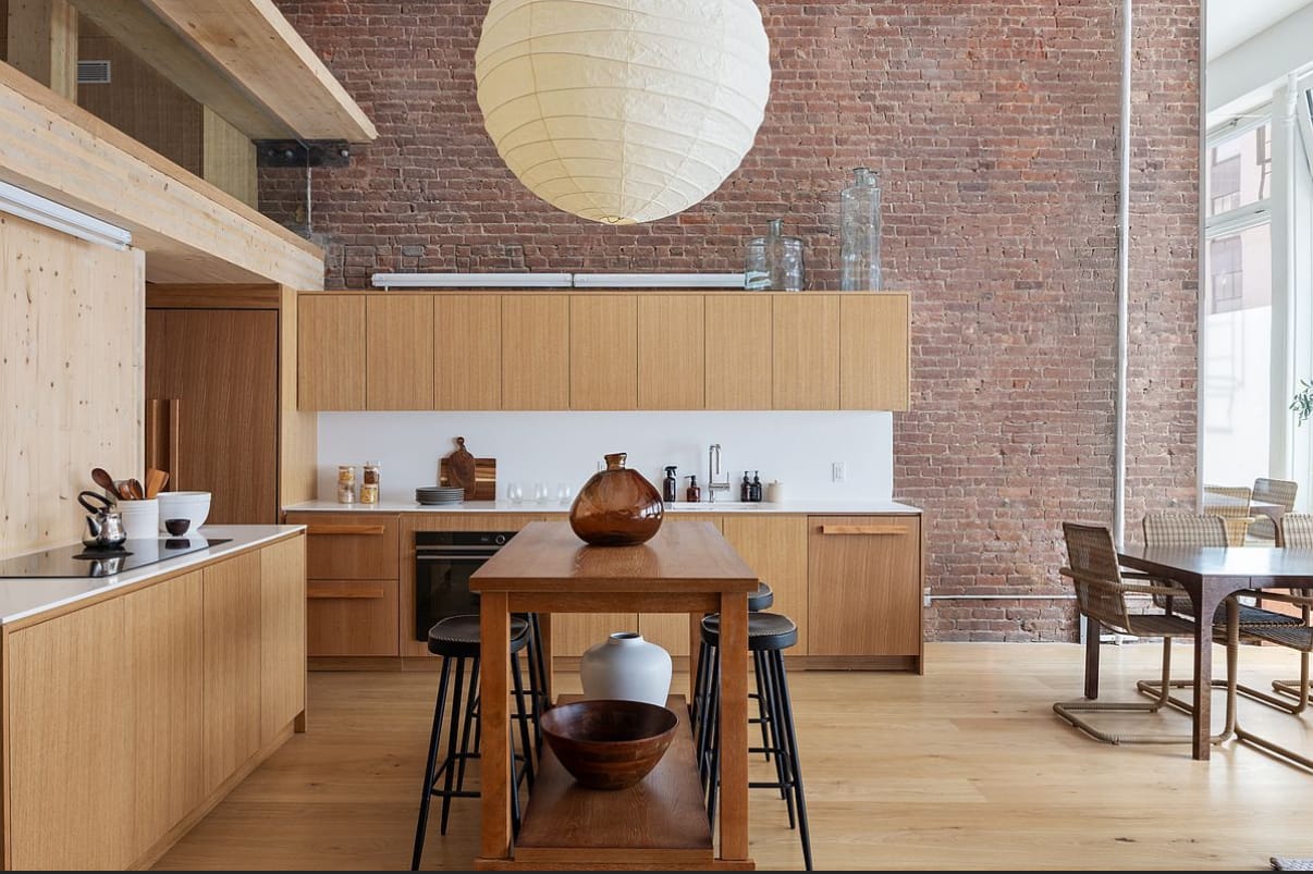 DUMBO-style loft kitchen with exposed brick — Green Cabinets NY, custom cabinetry in DUMBO, Brooklyn