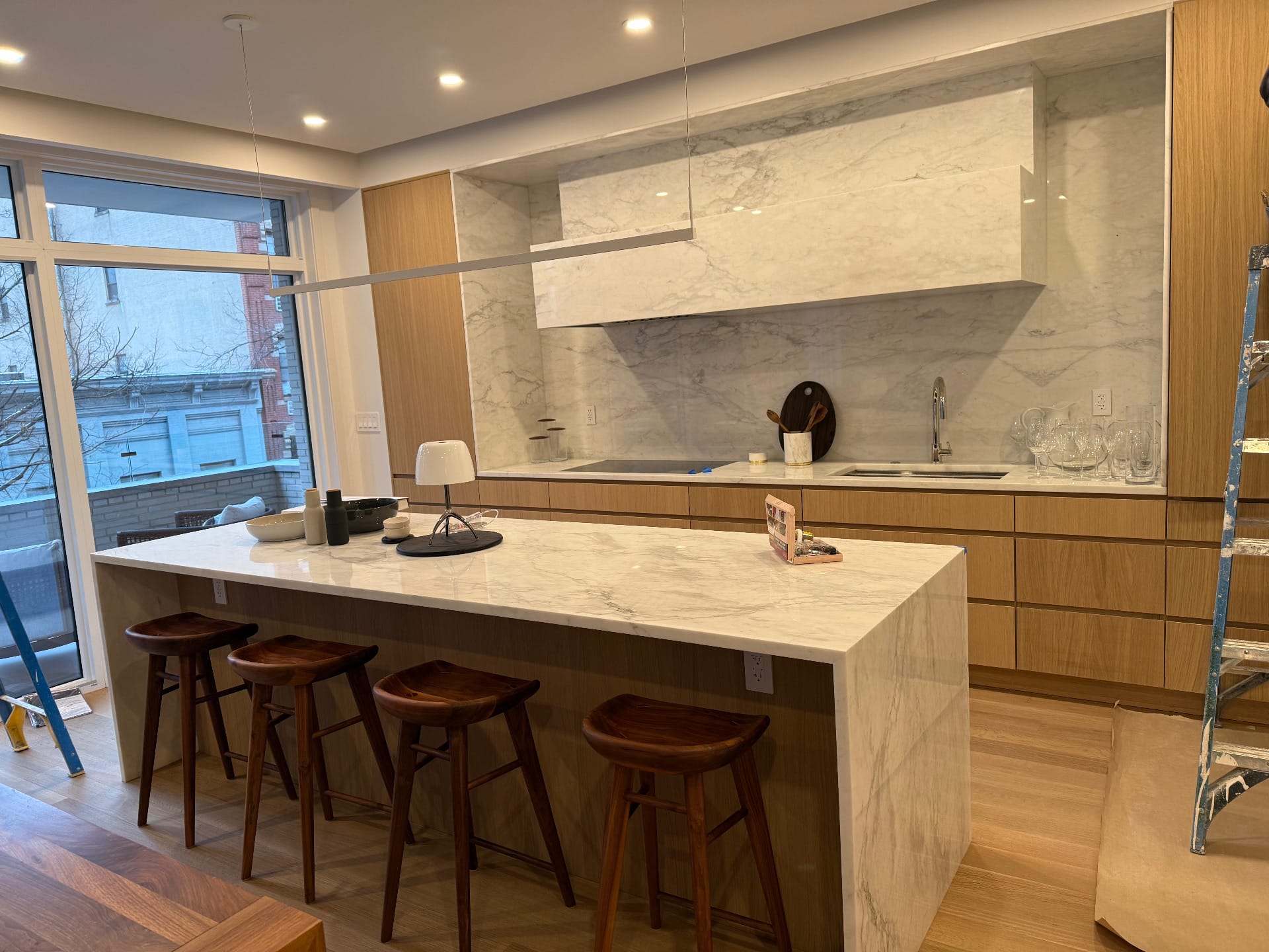 Loft kitchen with white oak and marble island — Green Cabinets NY, custom cabinetry in DUMBO, Brooklyn