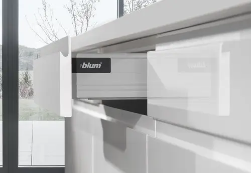 Close-up of premium Blum drawer hardware installation
