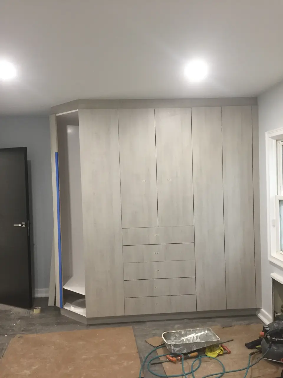 Gray wood wardrobe construction with open shelving design