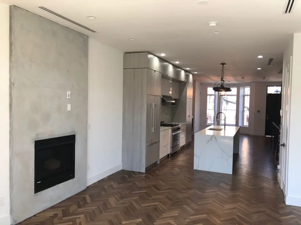 Contemporary kitchen with fireplace feature