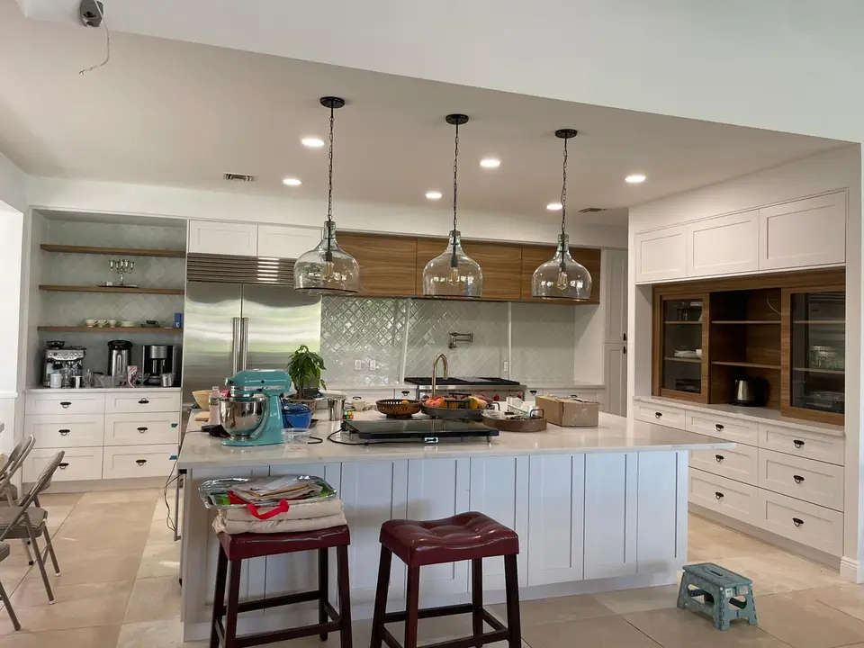 White kitchen with glass pendant lights