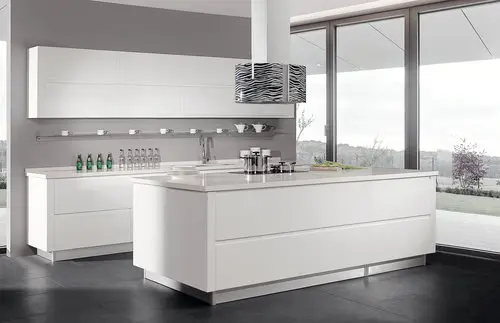 Minimalist white kitchen with modern island and contemporary lighting