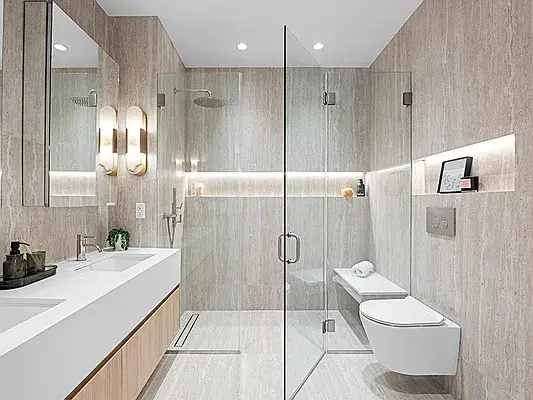Modern bathroom with wood vanity, glass walk-in shower, and marble tiles