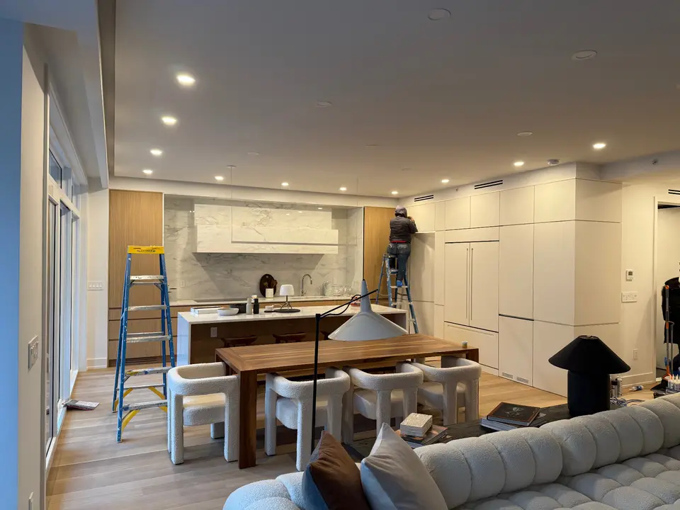 Open concept kitchen with marble and wood accents