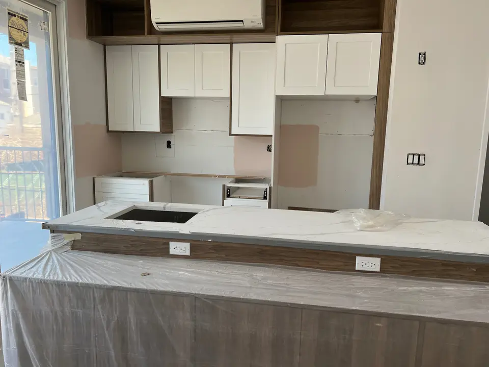 Two-tone kitchen with marble island